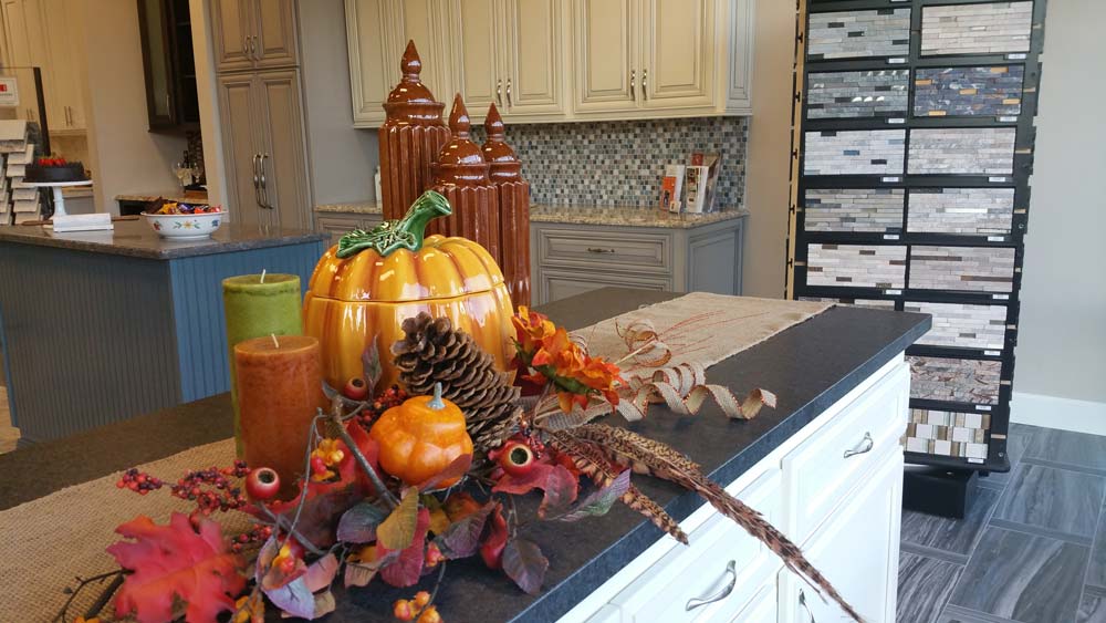 A prop pumpkin and some decorations on the kitchen island