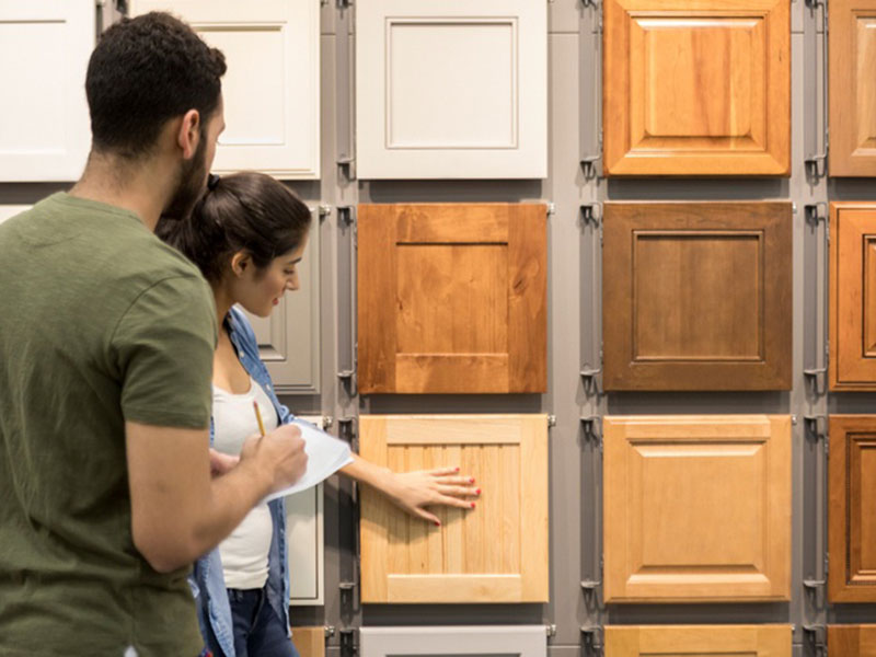 A Women Choosing a Cabinet