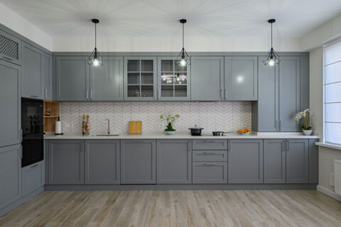 large renovated kitchen with gray cabinetry