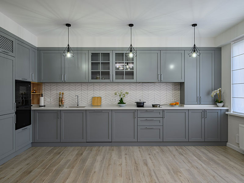 large renovated kitchen with gray cabinetry