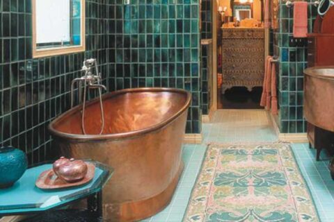 A copper tub in a bathroom