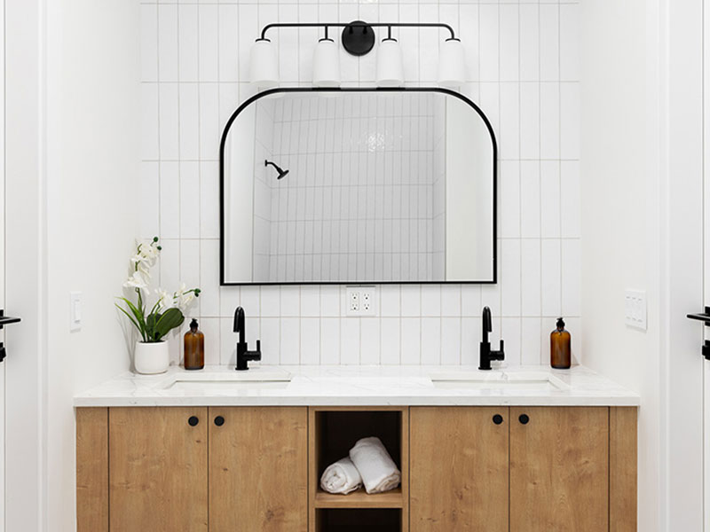 vanity and mirror in newly upgraded bathroom